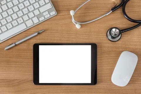 Doctors desk with tablet computer Stock Photos