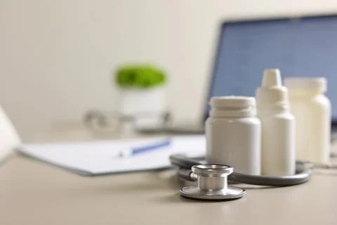 Doctor's desk top view. Set of different doctor accessories on a colored Stock Photos