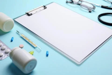 Doctor's desk top view. Set of different doctor accessories on a colored Stock Photos