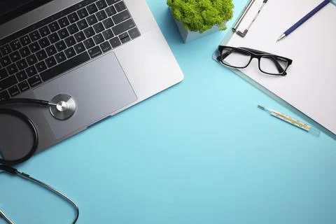 Doctor's desk top view. Set of different doctor accessories on a colored Stock Photos
