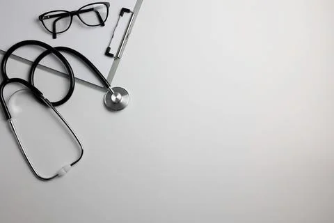 Doctor's desk top view. Set of different doctor accessories on a colored Foto stock