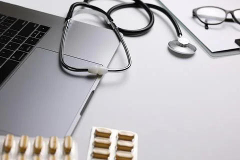 Doctor's desk top view. Set of different doctor accessories on a colored Stock Photos