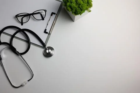 Doctor's desk top view. Set of different doctor accessories on a colored Stock Photos