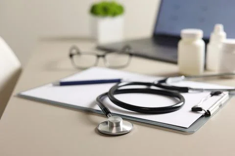 Doctor's desk top view. Set of different doctor accessories on a colored Foto stock