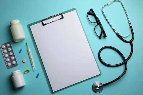 Doctor's desk top view. Set of different doctor accessories on a colored Stock Photos