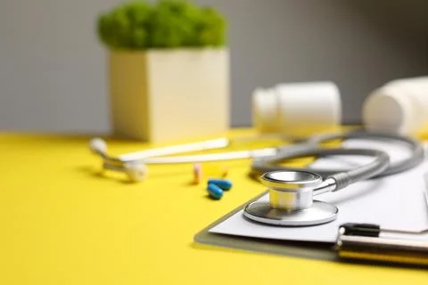 Doctor's desk top view. Set of different doctor accessories on a colored Stock Photos