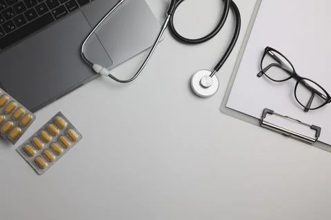 Doctor's desk top view. Set of different doctor accessories on a colored Foto stock