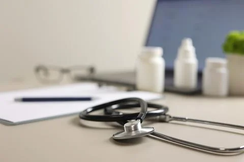 Doctor's desk top view. Set of different doctor accessories on a colored Stock Photos
