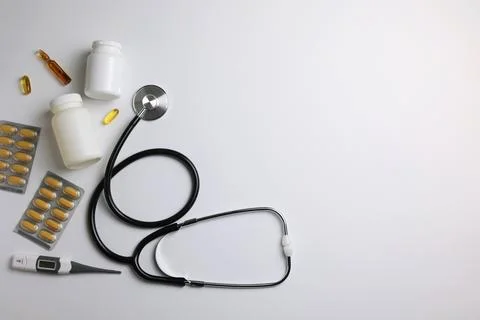Doctor's desk top view. Set of different doctor accessories on a colored Stock Photos