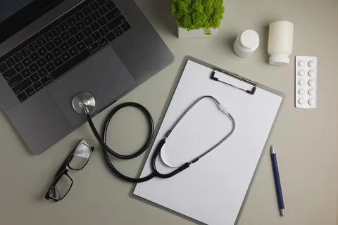 Doctor's desk top view. Set of different doctor accessories on a colored Stock Photos