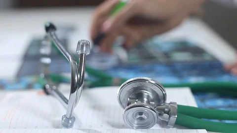 Doctors discuss the diagrams Stock Footage 86690370