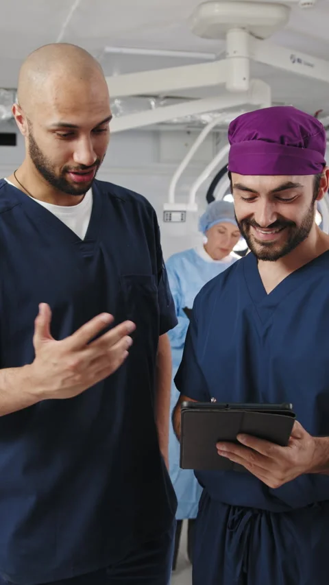 Doctors Discussing in Operating Room Stock Footage 316191845
