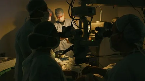 Doctors discussing in the operation theatre Stock Footage 77483018