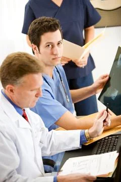 Doctors: doctor intern with x-ray Stock Photos