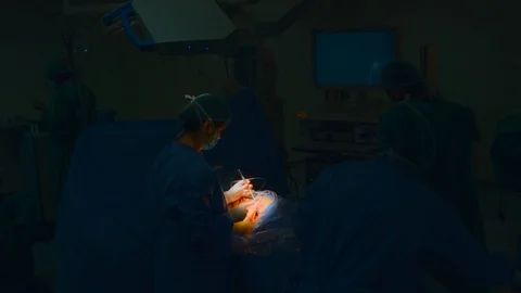 Doctors doing surgery Stock Footage 105820501