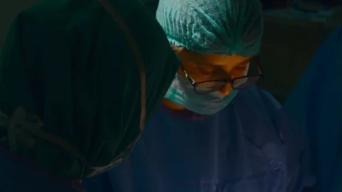 Doctors doing surgery Stock Footage 105820579