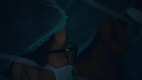 Doctors doing surgery Stock Footage 105822299