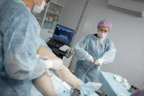 Doctors doing vein surgery procedure Stock Photos