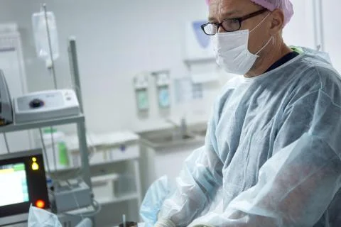 Doctors doing vein surgery procedure Stock Photos