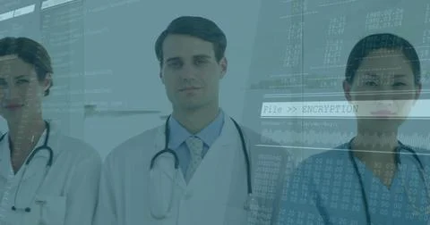 Doctors with encryption and data processing image overlay in hospital setting Stock Photos