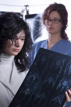 Doctors examine x-rays Stock Photos