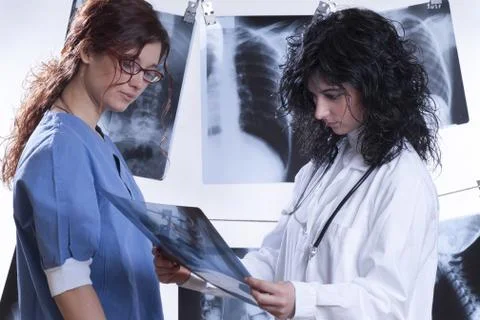 Doctors examine x-rays Stock Photos