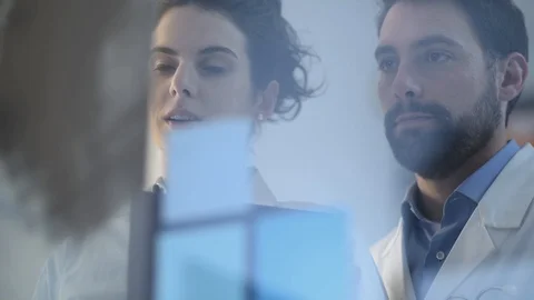Doctors examining a patient's x-ray Stock Footage 86682739