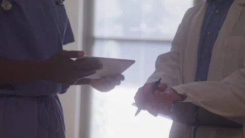 Doctors Exchange Notes In The Hallway Stock Footage 219585441