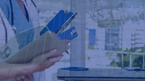 Doctors exchanging glance, comparing notes on tablet animating health graph on Stock Footage 310973093