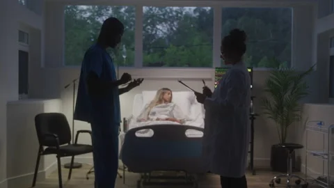 Doctors Exchanging Notes Stock Footage 218456150