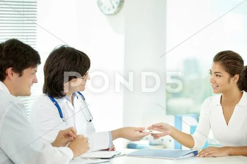Doctors giving a prescription to patient Stock Photos