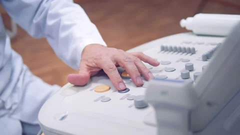 The doctor's hand controls the examination process of the patient. Stock Footage 87836254