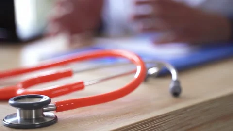 Doctor's hand explaining and calming down patient Stock Footage 212940761