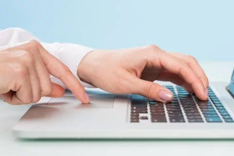 Doctor's hand is typing the data into the system. Using a laptop computer Stock Photos