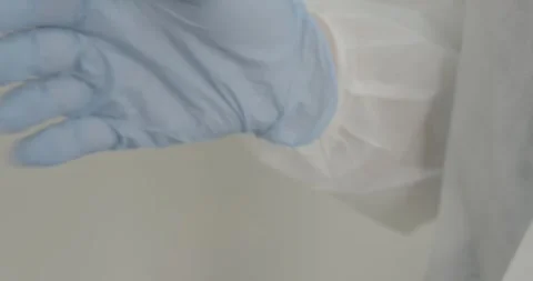 Doctor's hands in blue gloves Video stock 287987893