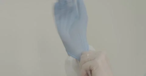 Doctor's hands in blue gloves Stock Footage 287988030