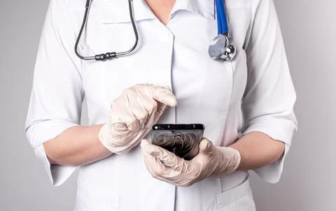 Doctors hands closeup using abstarct mobile phone app Stock Photos