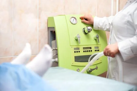 Doctor's hands, a device for cleaning the rectum in the hospital for, the doctor Stock Photos