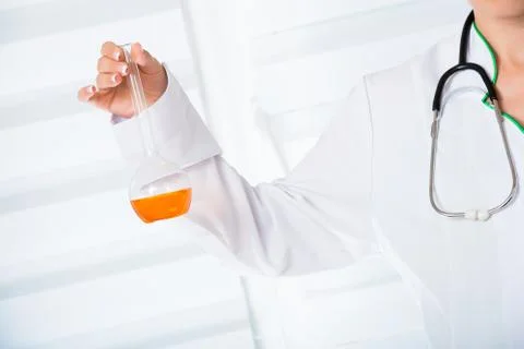 Doctor's hands with flask Foto stock