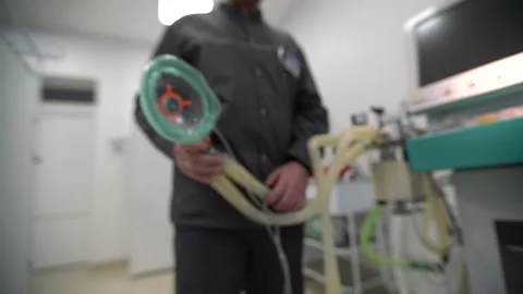 Doctor's hands put on an oxygen mask. Stock Footage 198546328