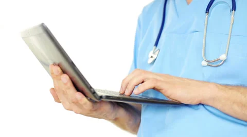 Doctors hands typing on laptop, isolated on white Stock Footage 37344378