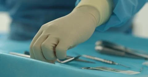 Doctor's hands with a working tool. Preparation and process of dental treat.. Stock Photos