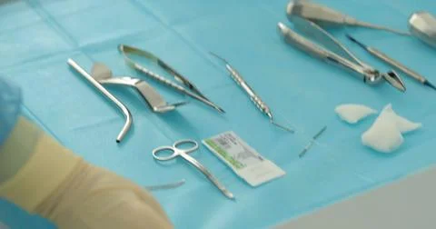 Doctor's hands with a working tool. Preparation and process of dental treat.. Stock Photos
