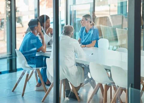 Doctors, healthcare team and meeting for a discussion, planning or training at Stock Photos