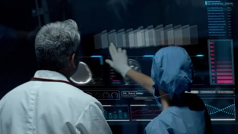 Doctors Interacting on Big Transparent Display Working with Patient Brain Scan Vídeo Stock 121159057