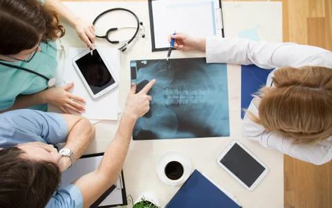 Doctors interpreting x-ray image 写真素材