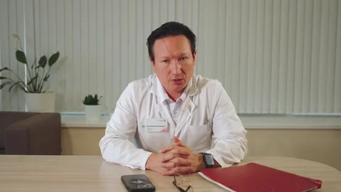Doctor's interview, doctor speaks on camera Stock Footage 313662866