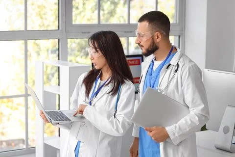 Doctors with laptops analyzing scientific data in laboratory Stock Photos