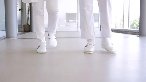 On Doctor's Legs While They Walking Through Hospital Close Up Stock Footage 87768624