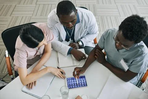 Doctors Looking at Brain X Rays Stock Photos